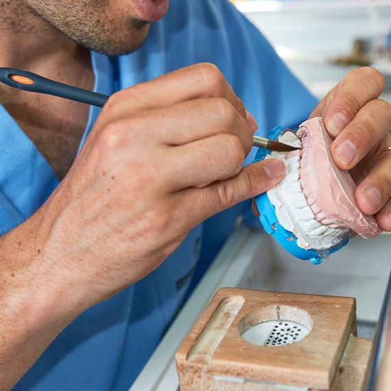Dental technician working in the dental laboratory